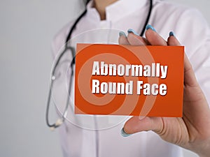 Healthcare concept about Abnormally Round Face with sign on the piece of paper