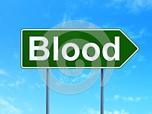 Healthcare concept: Blood on road sign background