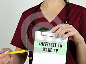 Healthcare concept about DIFFICULT TO WAKE UP with sign on the piece of paper