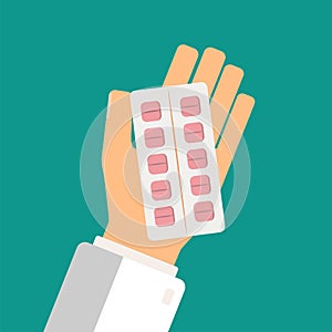 Healthcare concept. Doctor hand holding blister pack of pills. T