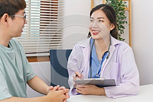 Healthcare concept, Female doctor give advice and writing prescription to patient in clinic