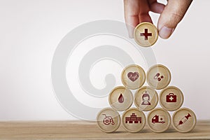 Healthcare concept about of health and medical insurance, Hand arranging block sphere stacking with icon health care medical on