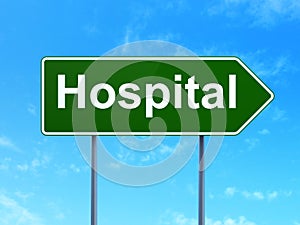 Healthcare concept: Hospital on road sign background