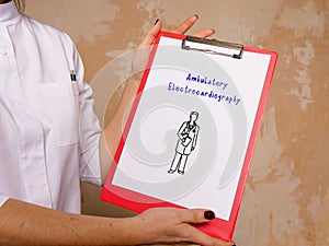 Healthcare concept meaning Ambulatory Electrocardiography with inscription on the sheet