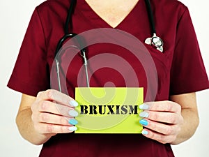 Healthcare concept meaning Bruxism Teeth Grinding with phrase on the piece of paper