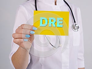 Healthcare concept meaning Digital Rectal Examination DRE with inscription on the piece of paper