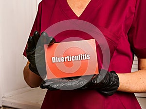 Healthcare concept meaning Diverticulitis with inscription on the piece of paper photo
