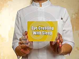 Healthcare concept meaning Eye Crusting With Sleep with sign on the page photo