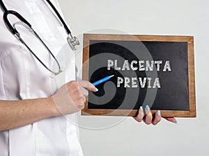 Healthcare concept about PLACENTA PREVIA with sign on the black board photo