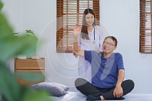 Healthcare concept, Senior man painful while doing physiotherapy and stretching by woman caregiver