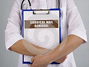 Healthcare concept about SURGICAL NAIL REMOVAL with sign on the sheet