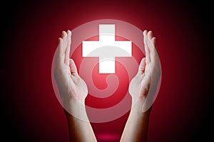 Healthcare concept, Woman hand holding and protect medical symbol on red background.