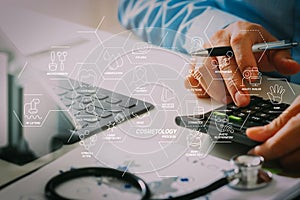 Healthcare costs and fees concept.Hand of smart doctor used a ca