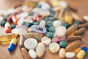 Healthcare, depression or table with medicine pills or supplements products at drugstore clinic. Pharmaceuticals