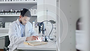 Healthcare, doctor and laboratory scientist using microscope to examining monkeypox virus. Serious medical professional