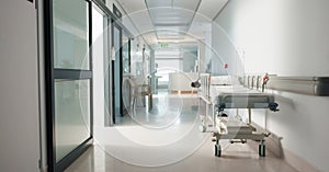 Healthcare, hospital and empty hallway with bed for medical care, health insurance and help in surgery. ER, emergency