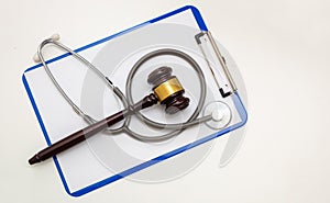Healthcare and Law, Judge gavel and doctor clipboard isolated on white, overhead