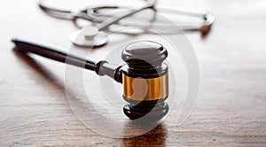 Healthcare Law. Medical stethoscope and judge gavel on lawyer office desk