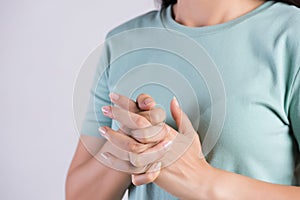 Healthcare and medical concept. Close up woman cracking knuckles