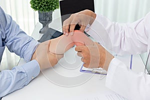 Healthcare and medical concept, Doctor explain wrist pain symptoms and medical treatment to patient in hospital