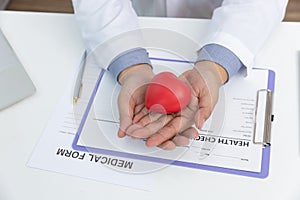 Healthcare and medical concept, Doctor holding heart ball and explain heart disease symptoms and medical treatment to patient in