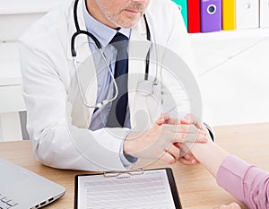 Healthcare and medical concept - doctor with patient measuring