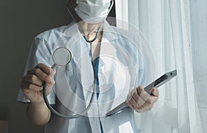 Healthcare and medical concept. Medicine doctor with stethoscope in hand and Patients come to the hospital background