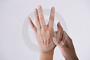 Healthcare and medical concept. Woman massaging her painful hand