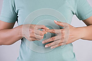 Healthcare and medical concept. Woman massaging her painful Index finger