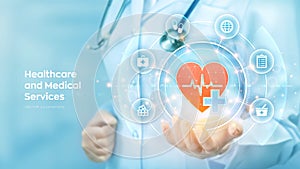 Healthcare, Medical services. Doctor holding in hand red heart shape and medical icon network connection on virtual screen. Health