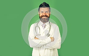 Healthcare, medical staff concept. Portrait of smiling doctor in workwear with crossed arms. Physician in white medical