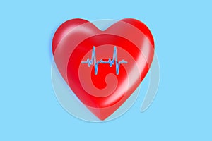 Healthcare and medicine concept. close up of red heart with ecg line on blue background.