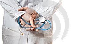 Healthcare And Medicine concept. Doctor. Unrecognizable Male Doctor Hands With Stethoscope Behin His Back, Closeup isolated on whi