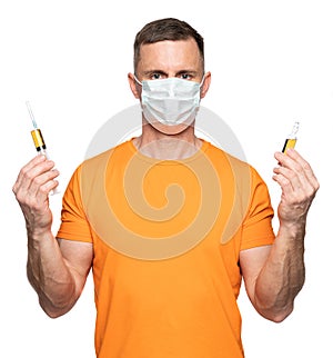 Healthcare and medicine concept.Young man in mask holding syringe and ampoule