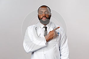 Healthcare, medicine and epidemic concept. Serious-looking handsome doctor, male physician showing patient chart with