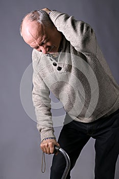 Healthcare, pain, stress and age concept. Sick old man. Senior man suffering from headache