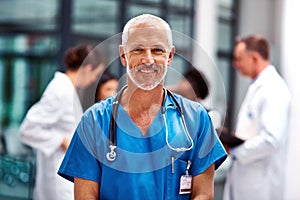 Healthcare, portrait of senior doctor or nurse with smile in hospital, happiness and support in medical career. Health