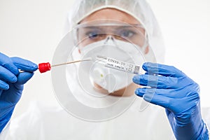 Healthcare professional holding Coronavirus COVID-19 test kit equipment photo