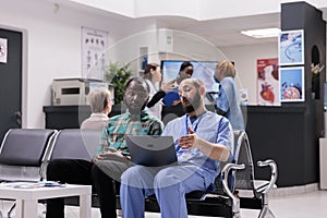 Healthcare professional showing radiological images to patient on computer