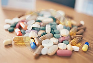 Healthcare, tablets or table with medicine pills or supplements products at drugstore clinic. Pharmaceuticals background