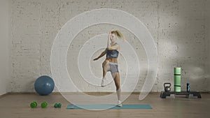 Healthcare and wellness advertisement concept. Athletic attractive woman fitness coach doing cardio warm up for online