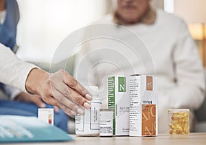 Healthcare workers are angels on earth. an unrecognizable nurse helping a patient with their medication during a checkup