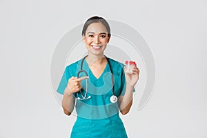 Healthcare workers, preventing virus, quarantine campaign concept. Smiling pretty asian female physician, nurse in