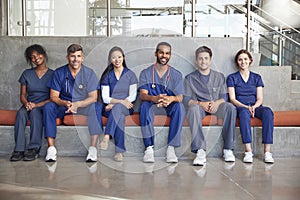 Healthcare workers sitting in a modern hospital, low angle