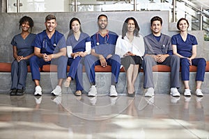 Healthcare workers sitting in a modern hospital, low angle