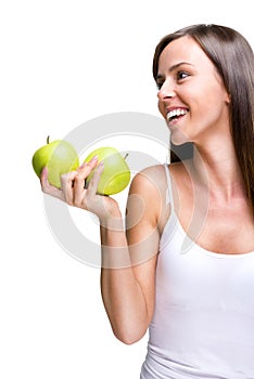 Healthful eating-Lovely woman holding an apple while laughing