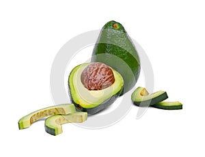 Healthful and fresh whole and half avocados with a large stone, isolated on a white background. Healthful lifestyle.