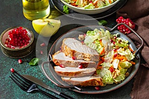 Healthly food. Baked meat steak salad and Chinese cabbage salad with apple, pomegranate, walnuts.