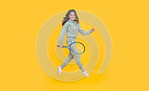 healthy and active lifestyle. sport success. happy childhood. kid jump with racket.