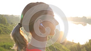Healthy Active Lifestyle. Young Attractive Jogger Woman Listening to Music.